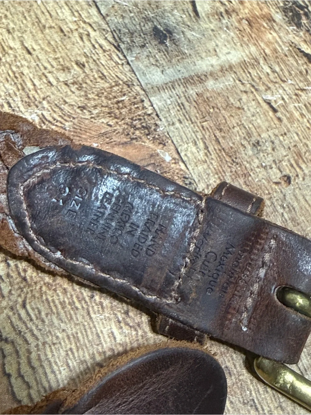Brown leather braided belt size 31 with brass buckle
